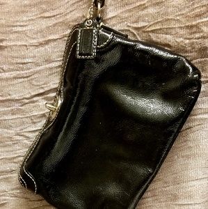 Coach Patten leather black wrist laying gently use